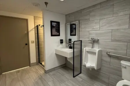 Shared bathroom with walk-in shower near pool and spa at Nisswa Hotel & Suites in Nisswa MN