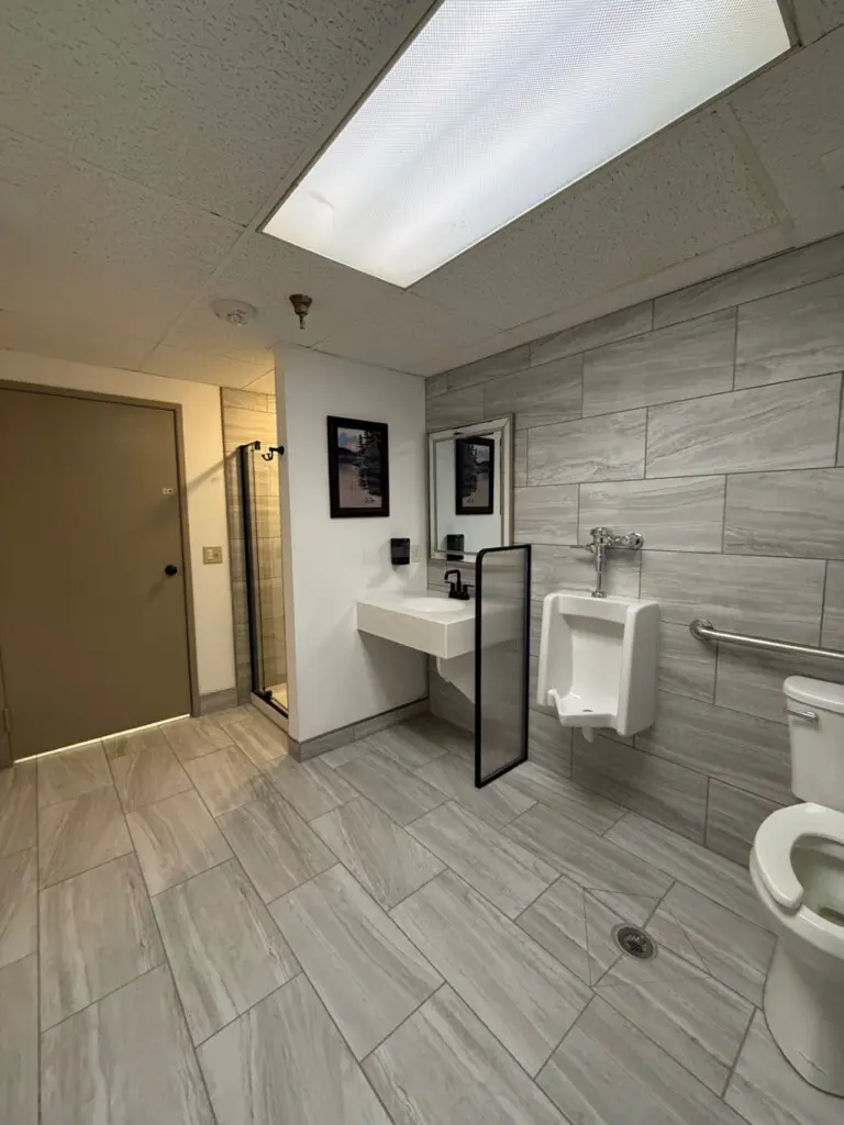 Shared bathroom with walk-in shower near pool and spa at Nisswa Hotel & Suites in Nisswa MN