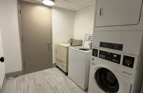 Guest laundry room with washer and dryer at Nisswa Hotel & Suites in Nisswa MN
