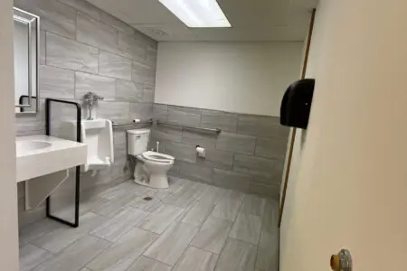 Shared bathroom with walk-in shower near pool and spa at Nisswa Hotel & Suites in Nisswa MN