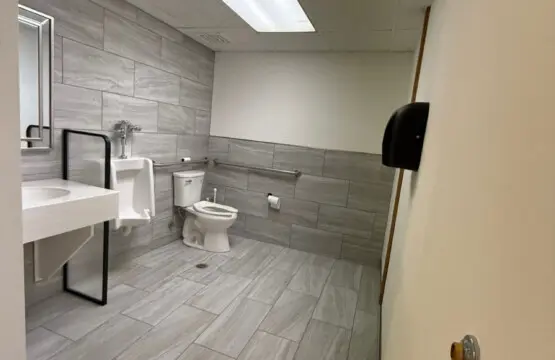 Shared bathroom with walk-in shower near pool and spa at Nisswa Hotel & Suites in Nisswa MN