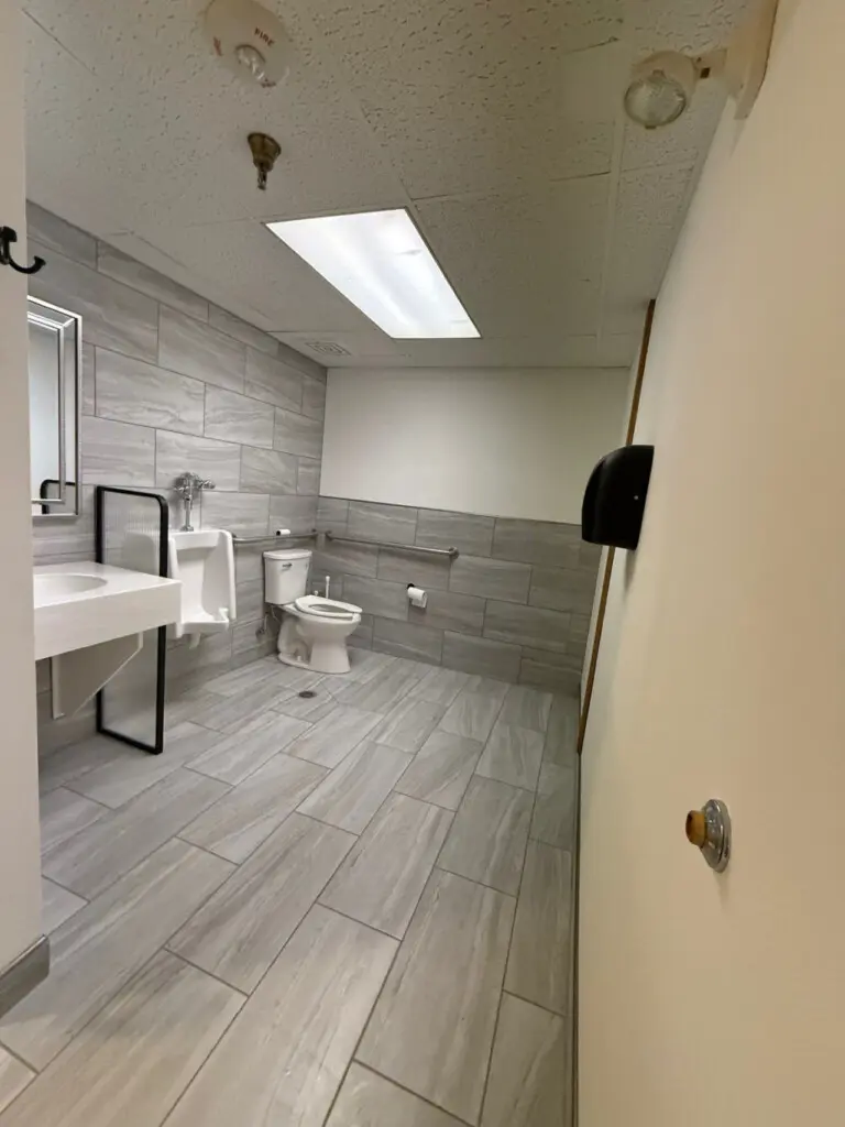 Shared bathroom with walk-in shower near pool and spa at Nisswa Hotel & Suites in Nisswa MN