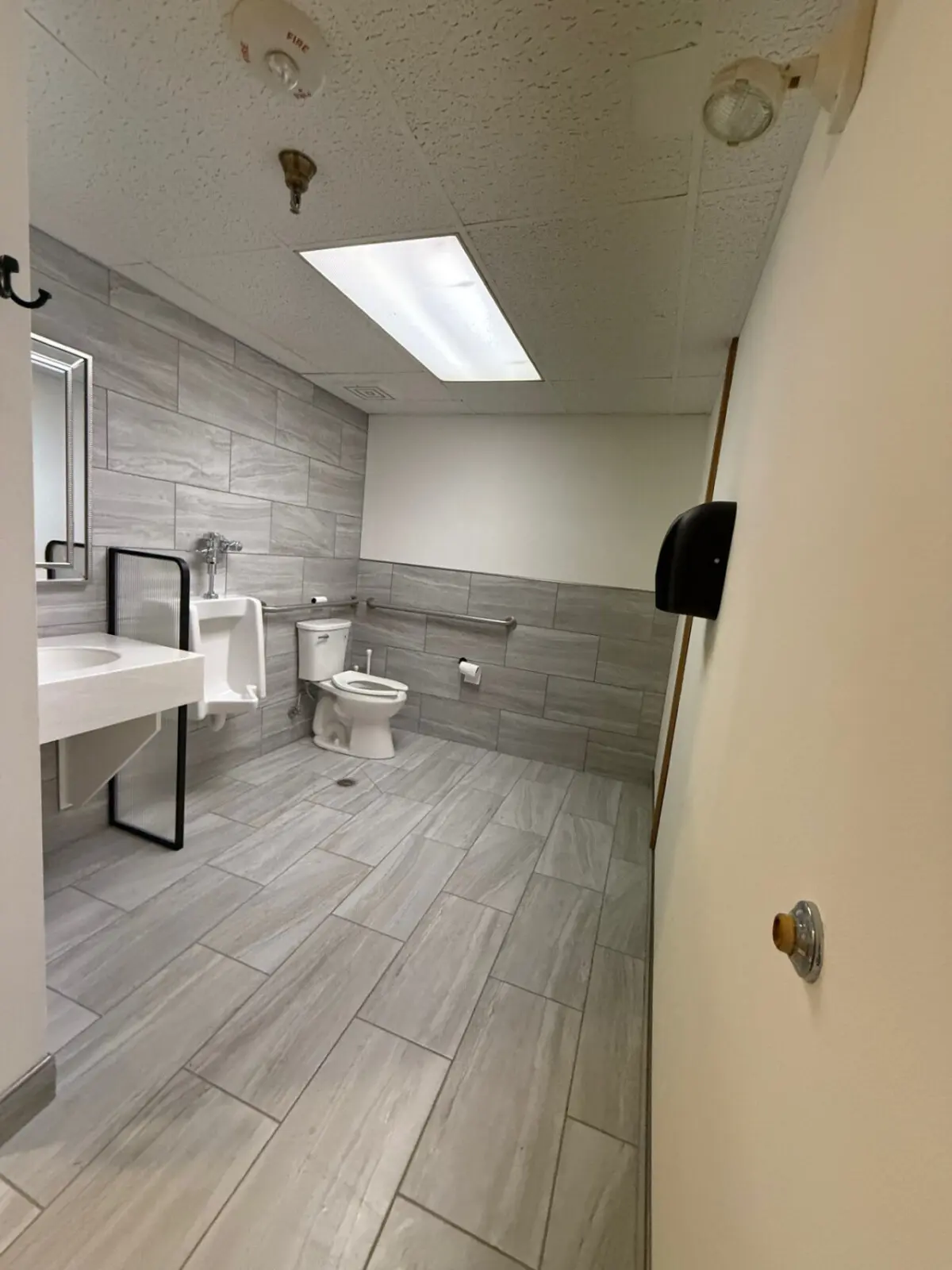 Shared bathroom with walk-in shower near pool and spa at Nisswa Hotel & Suites in Nisswa MN