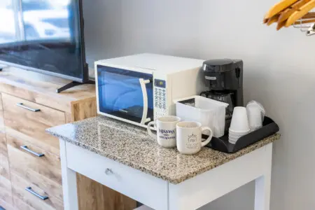 Queen hotel room at Nisswa Hotel & Suites in Nisswa MN with TV and in-room amenities